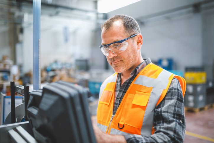 Electrical engineer working at manufacturing factory Electrical engineer working at manufacturing factory